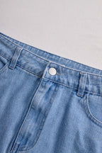 Stylish Denim Two-Piece Set With Asymmetrical Top And Fringed Skirt