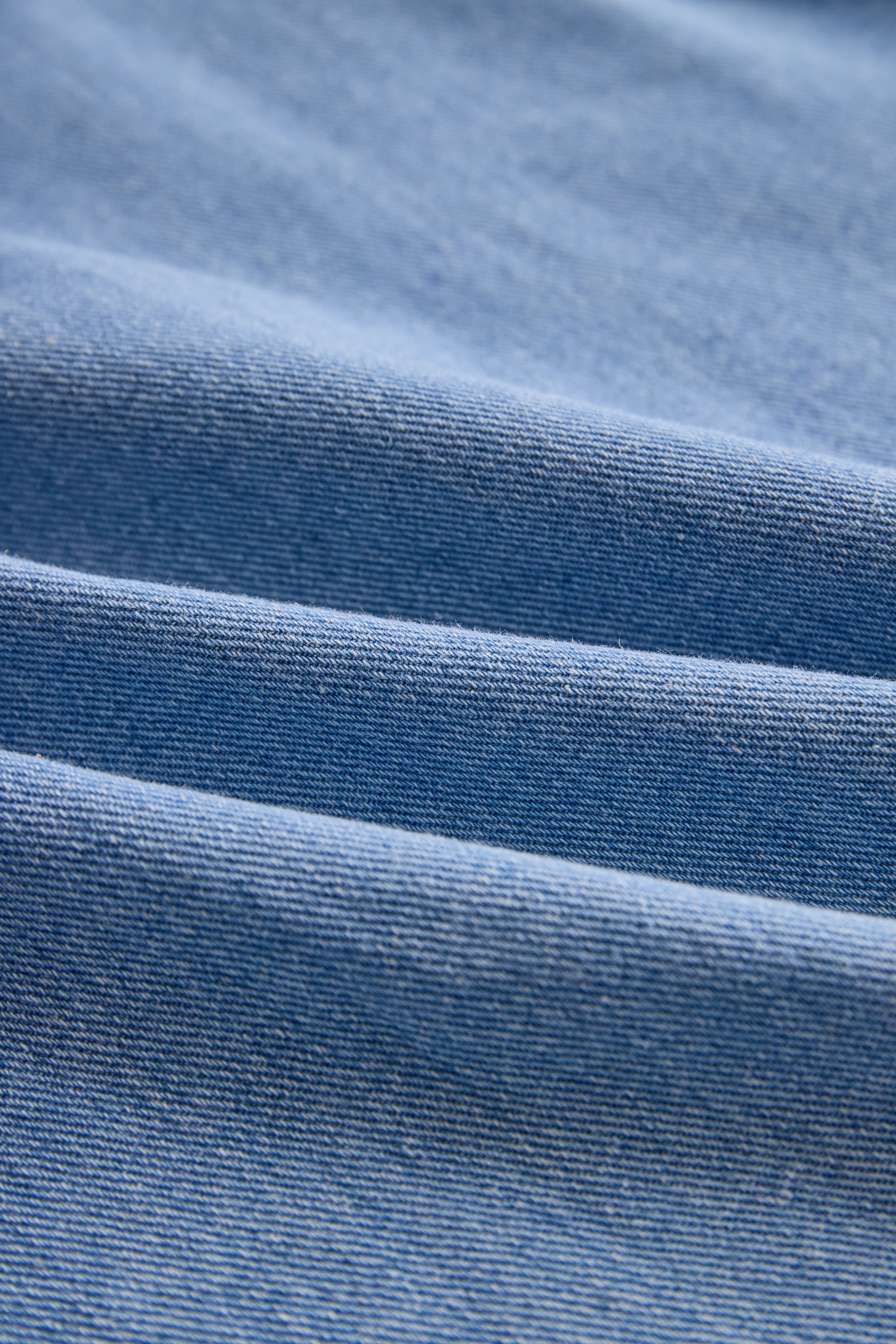 Stylish Denim Two-Piece Set With Asymmetrical Top And Fringed Skirt