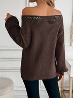 A long-sleeved sweater with a three-dimensional bow top